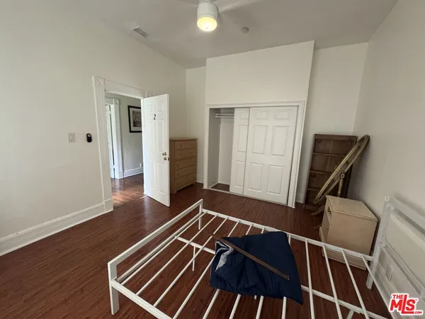 a view of a room with wooden floor and staircase