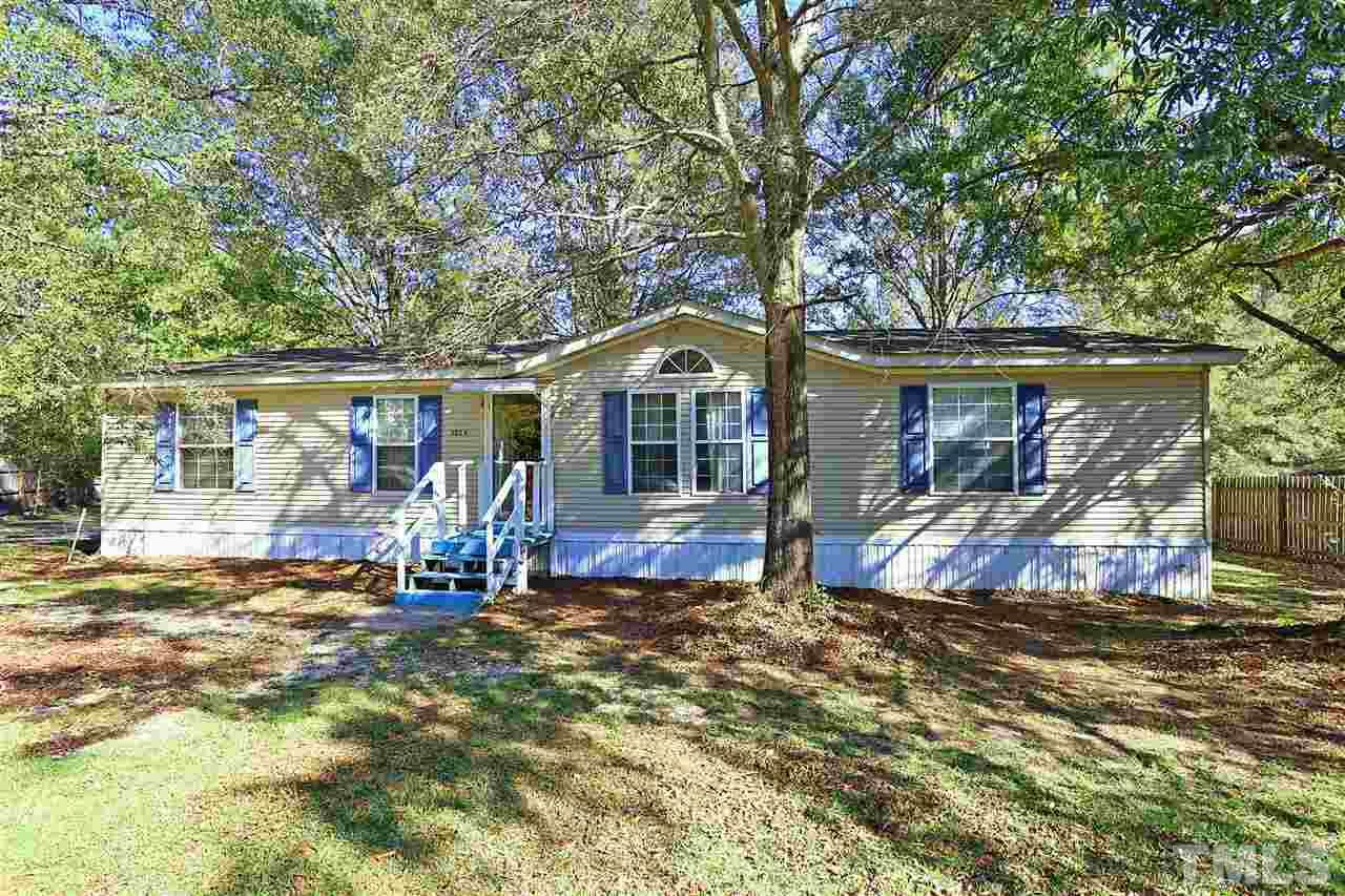 323 Aquilla Road, Unit A Benson, NC 27504 - Photo 1 of 25 a front view of a house with a yard