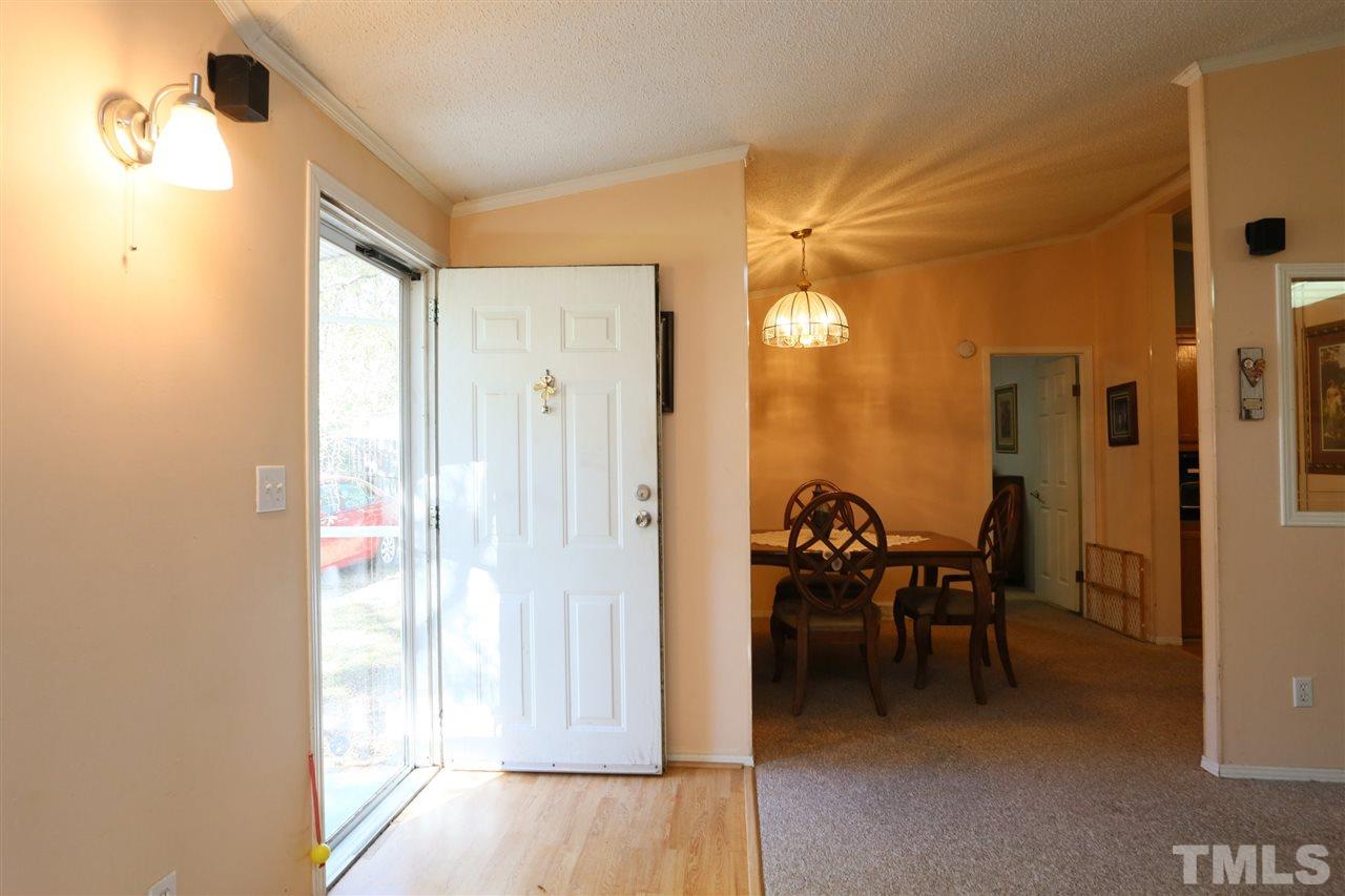 323 Aquilla Road, Unit A Benson, NC 27504 - Photo 11 of 25 a view of a livingroom with furniture and front door