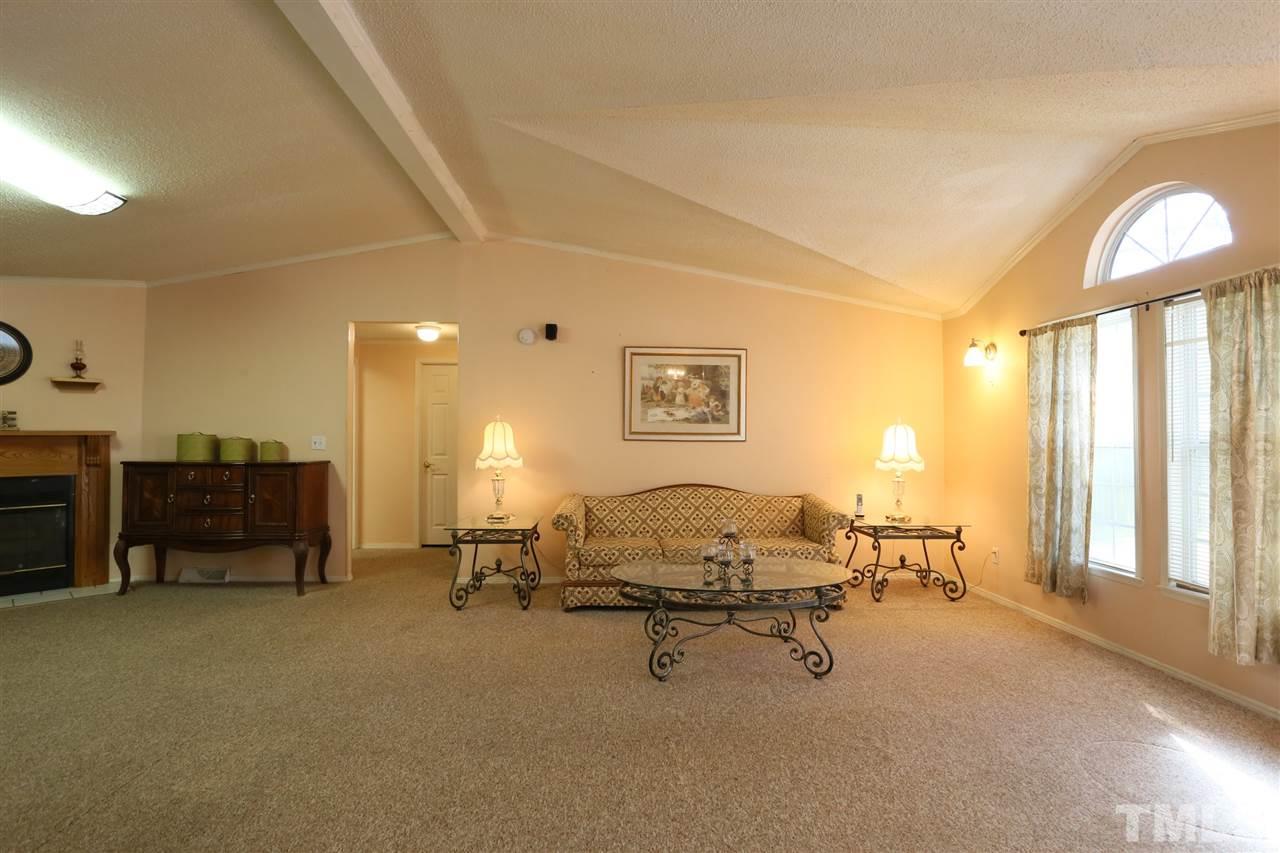 323 Aquilla Road, Unit A Benson, NC 27504 - Photo 13 of 25 a view of a livingroom with furniture and a window