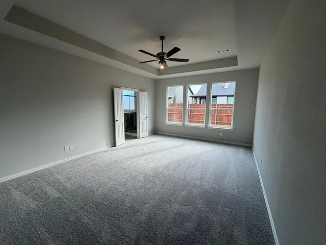 a bathroom with a tub a sink a mirror and a shower