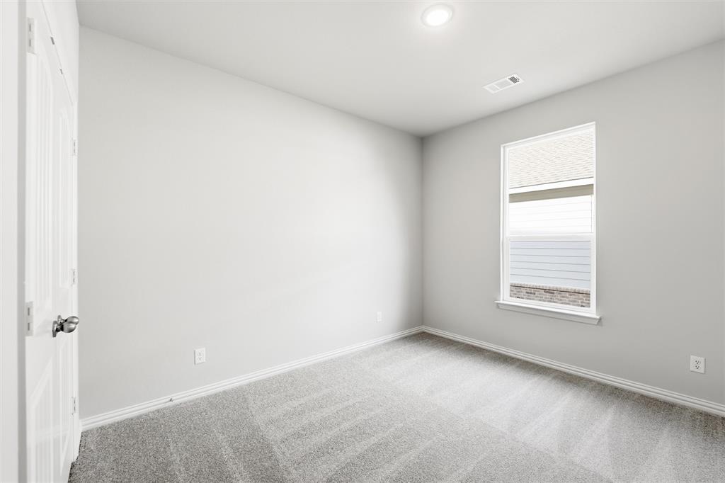 1244 Sabine River Lane Springtown, TX 76082 - Photo 20 of 26 a view of an empty room with a window