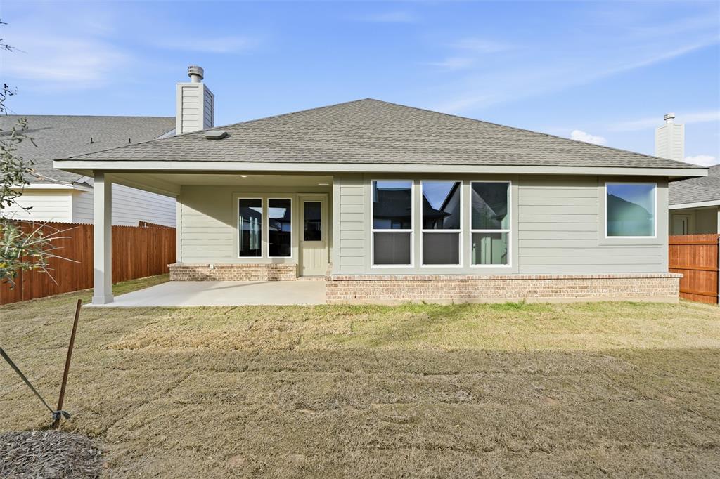 1244 Sabine River Lane Springtown, TX 76082 - Photo 24 of 26 a front view of a house with a yard