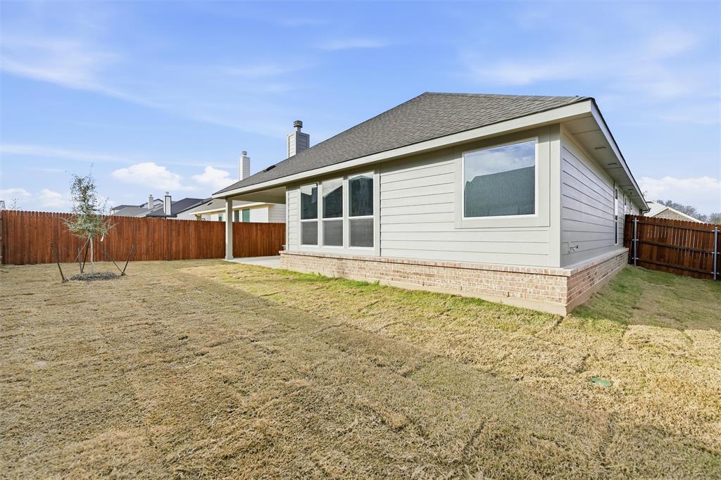 1244 Sabine River Lane Springtown, TX 76082 - Photo 25 of 26 a backyard of a house