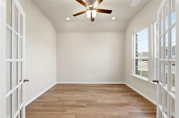 a view of an empty room with a window
