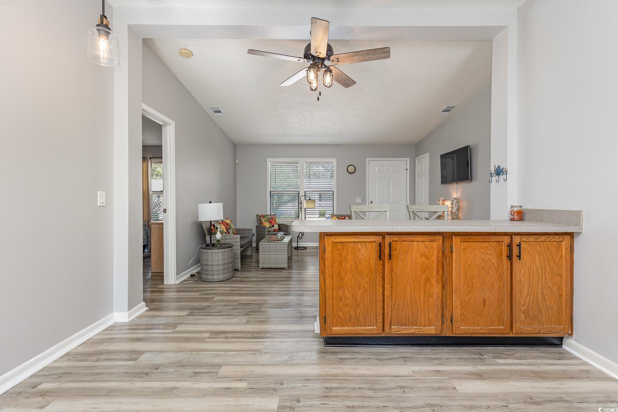 834 Keel Court Murrells Inlet, SC 29576 - Photo 8 of 35 Kitchen featuring vaulted ceiling, kitchen peninsu