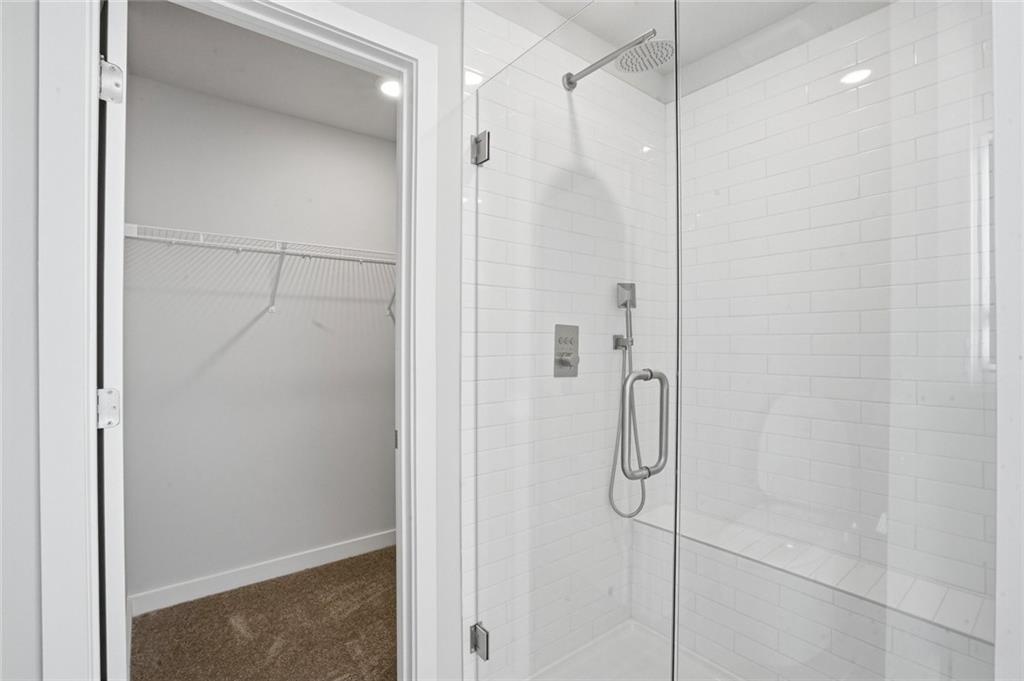 5351 Tolar Road South Fulton, GA 30213 - Photo 13 of 30 a bathroom with a glass shower door