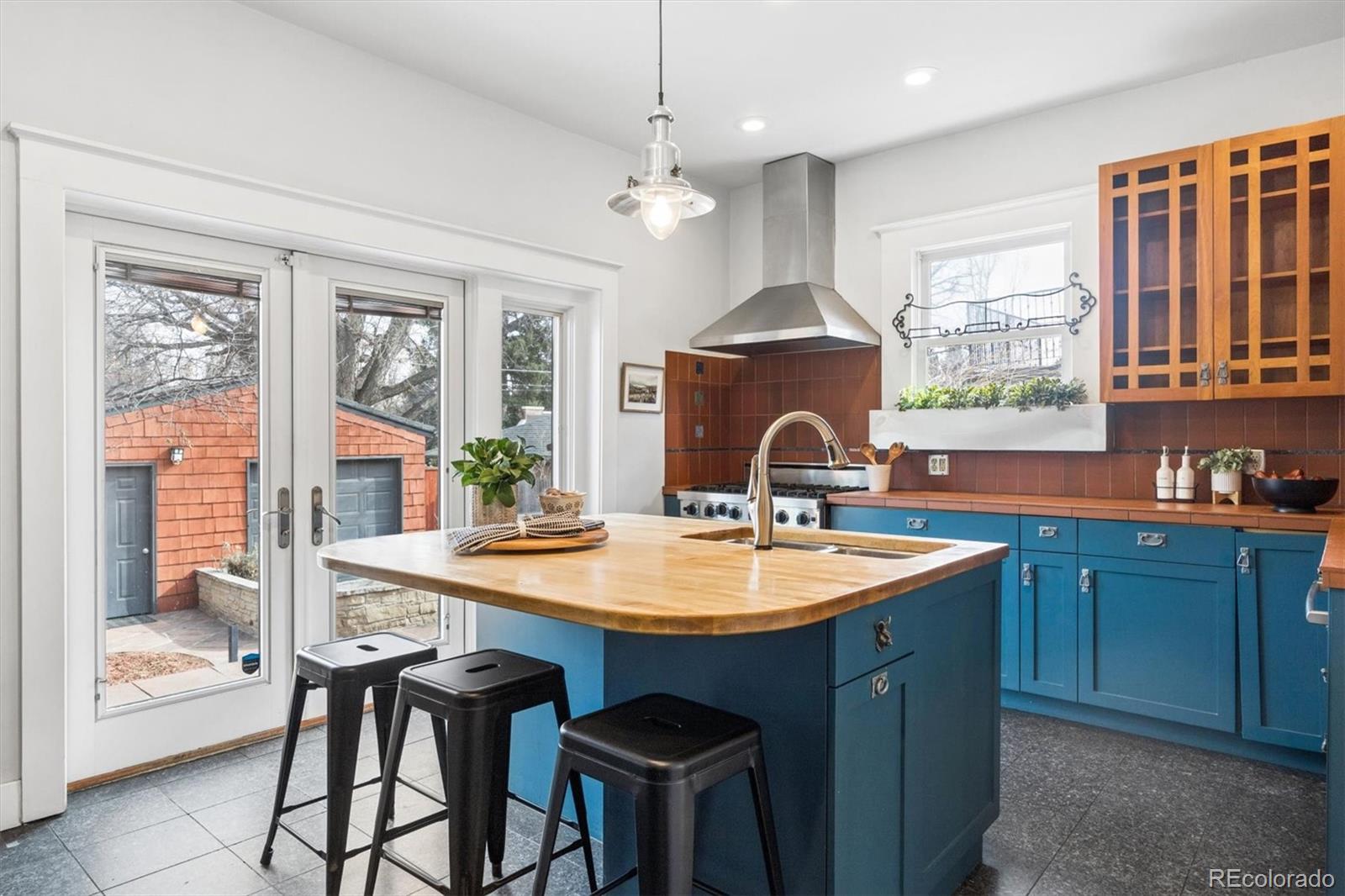 736 York Street Denver, CO 80206 - Photo 15 of 50 a dining table with chairs and window