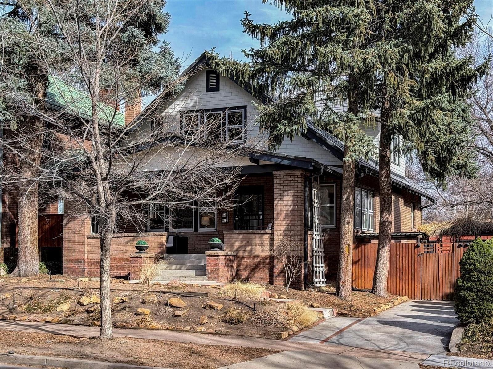 736 York Street Denver, CO 80206 - Photo 2 of 50 a view of a house with wooden fence