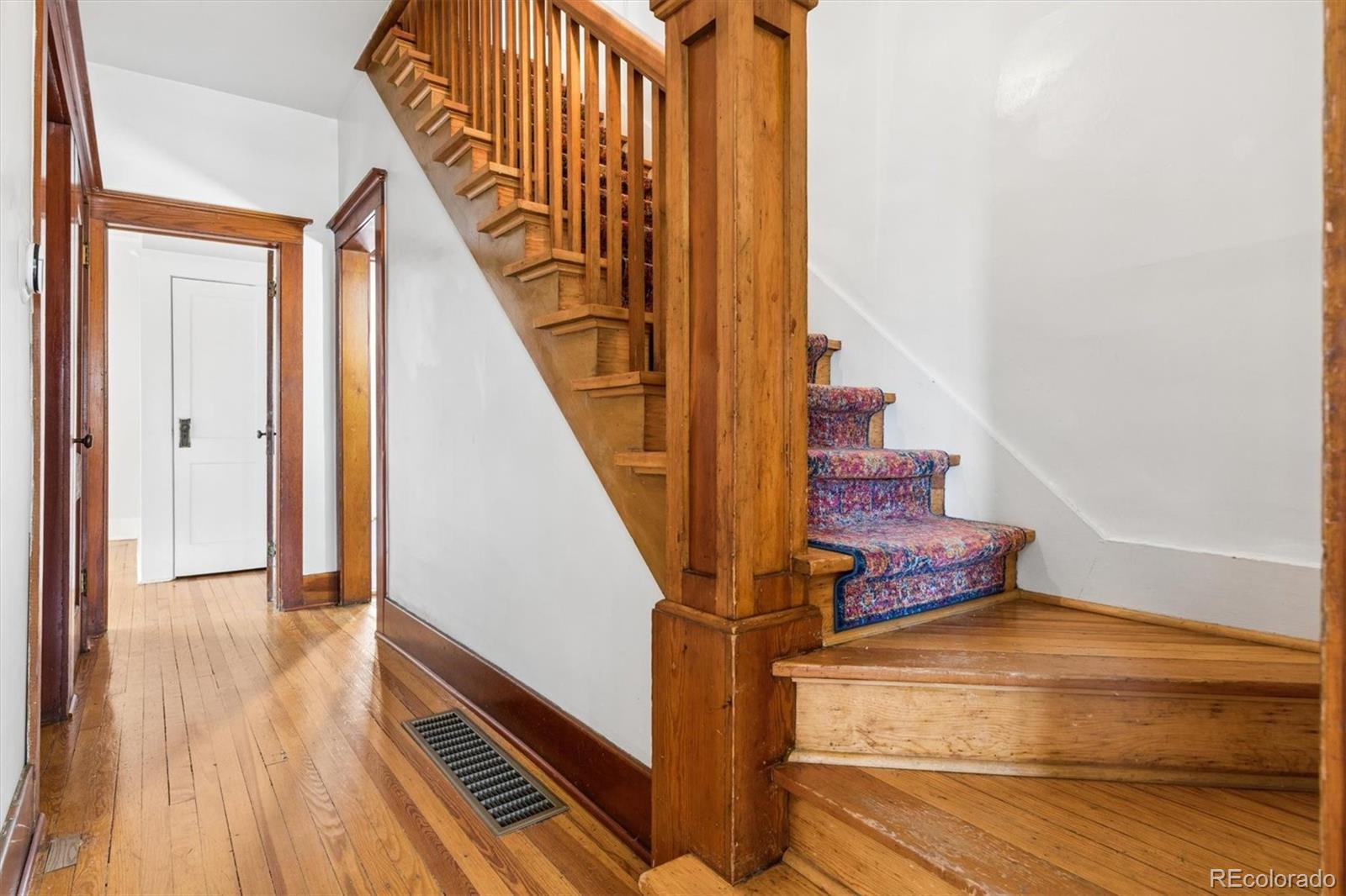 736 York Street Denver, CO 80206 - Photo 23 of 50 a view of entryway and hall with wooden floor