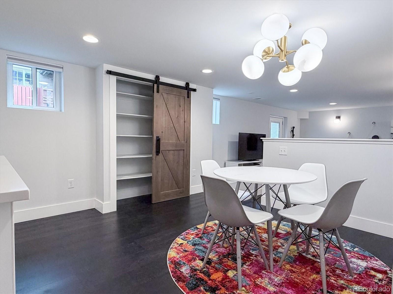 736 York Street Denver, CO 80206 - Photo 40 of 50 a view of a dining room with furniture and wooden floor