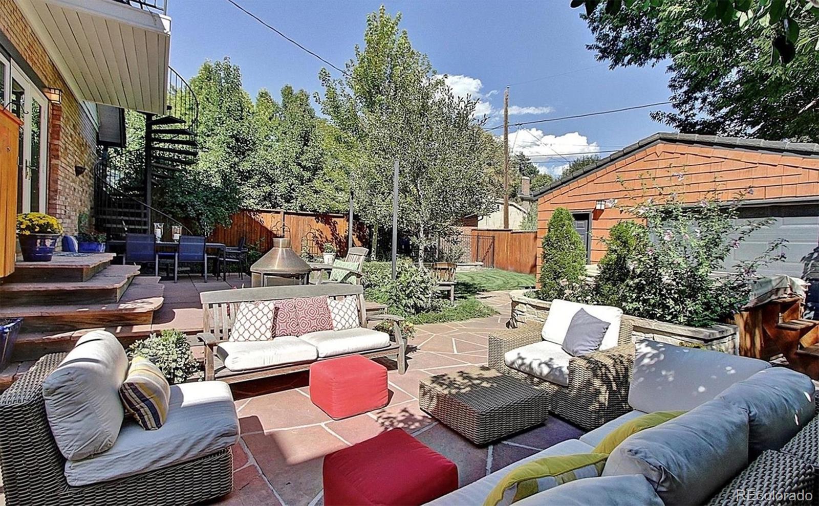736 York Street Denver, CO 80206 - Photo 46 of 50 a view of a patio with couches chairs and a fire pit