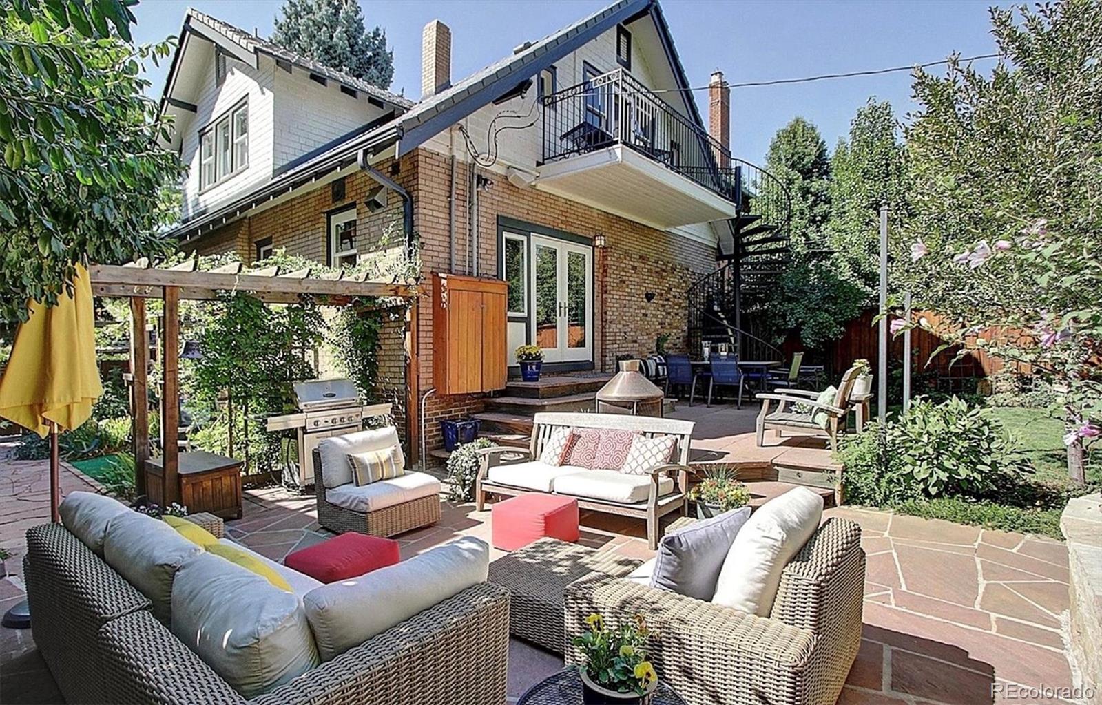 736 York Street Denver, CO 80206 - Photo 47 of 50 a view of a patio with couches table and chairs and potted plants