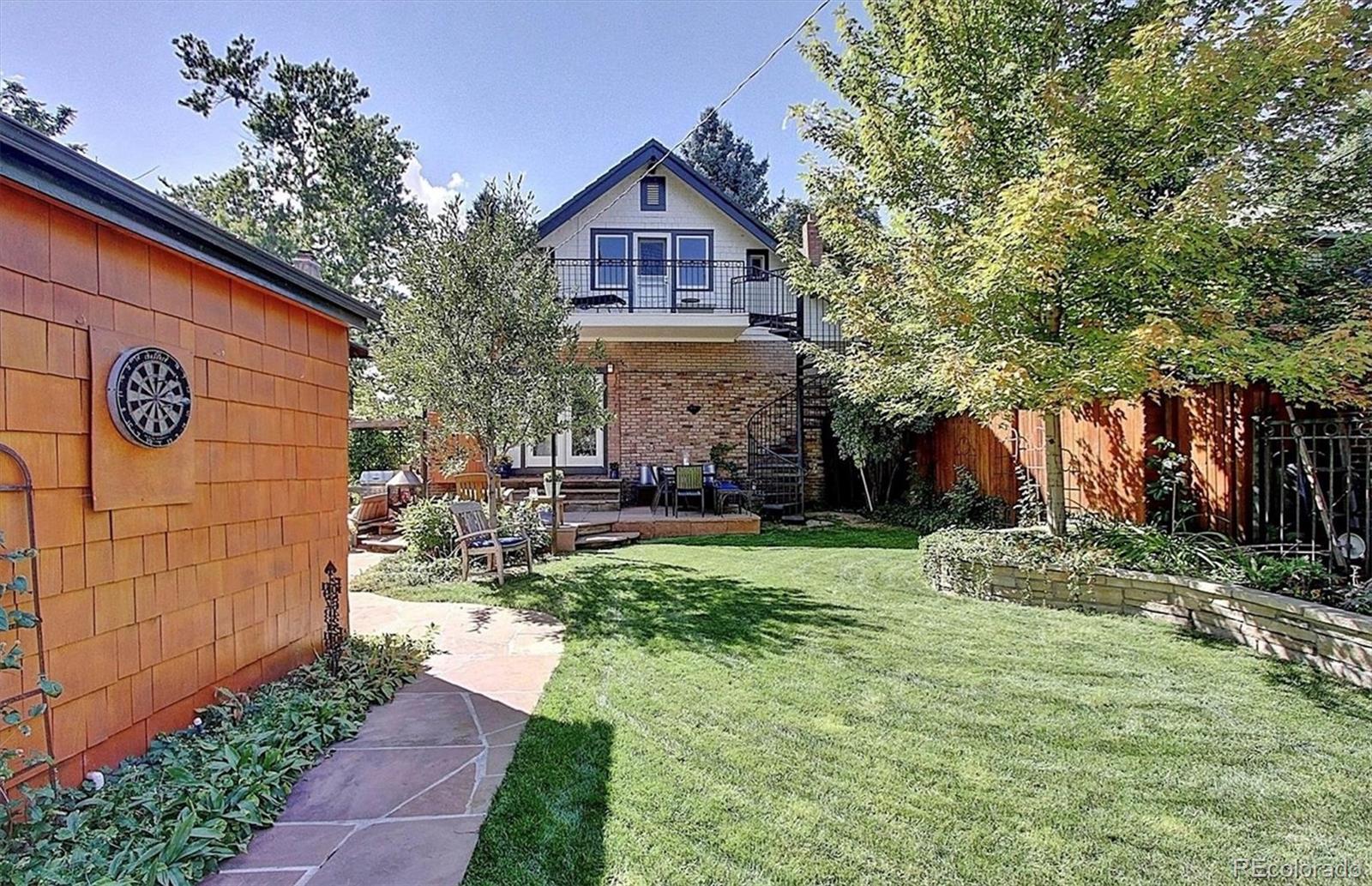 736 York Street Denver, CO 80206 - Photo 48 of 50 a front view of a house with garden