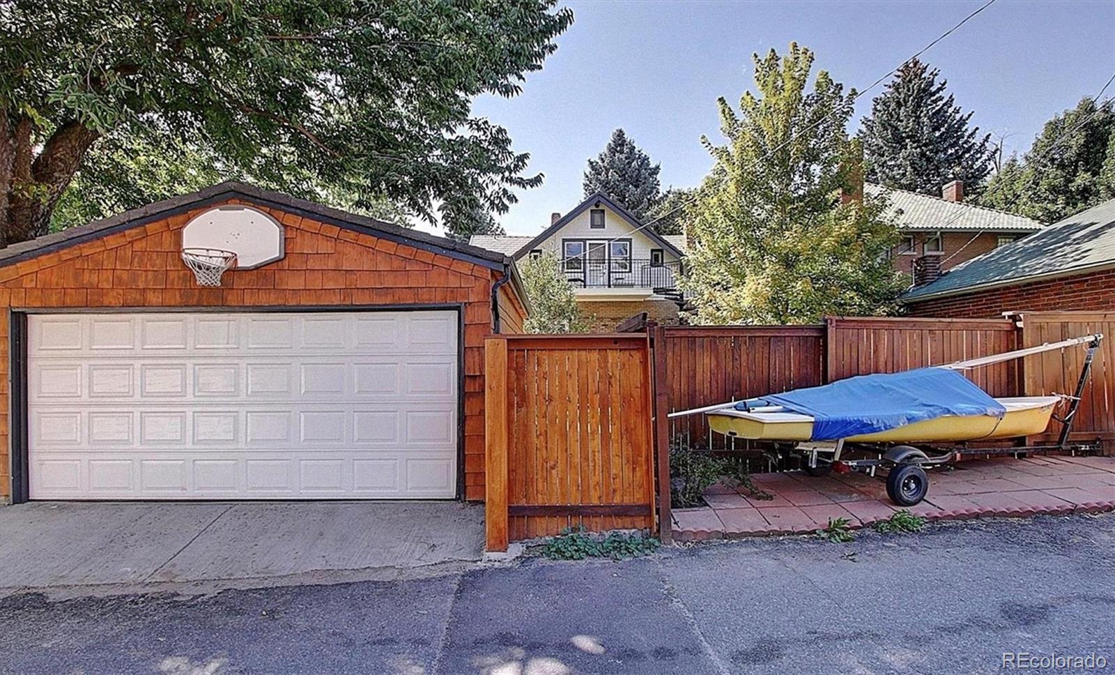 736 York Street Denver, CO 80206 - Photo 50 of 50 a backyard of a house with table and chairs