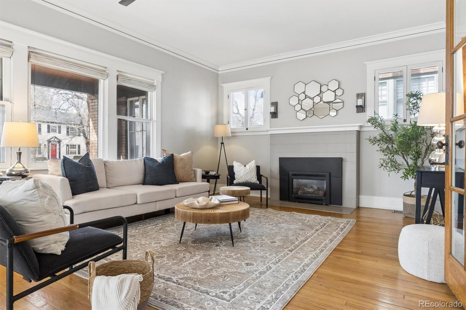 736 York Street Denver, CO 80206 - Photo 5 of 50 a living room with furniture and a fireplace