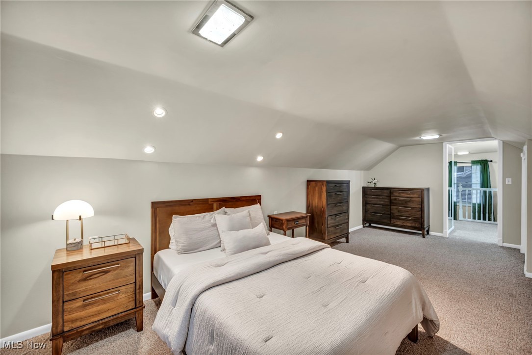 1317 Belrose Road Cleveland, OH 44124 - Photo 21 of 50 Bedroom with light colored carpet and lofted ceiling