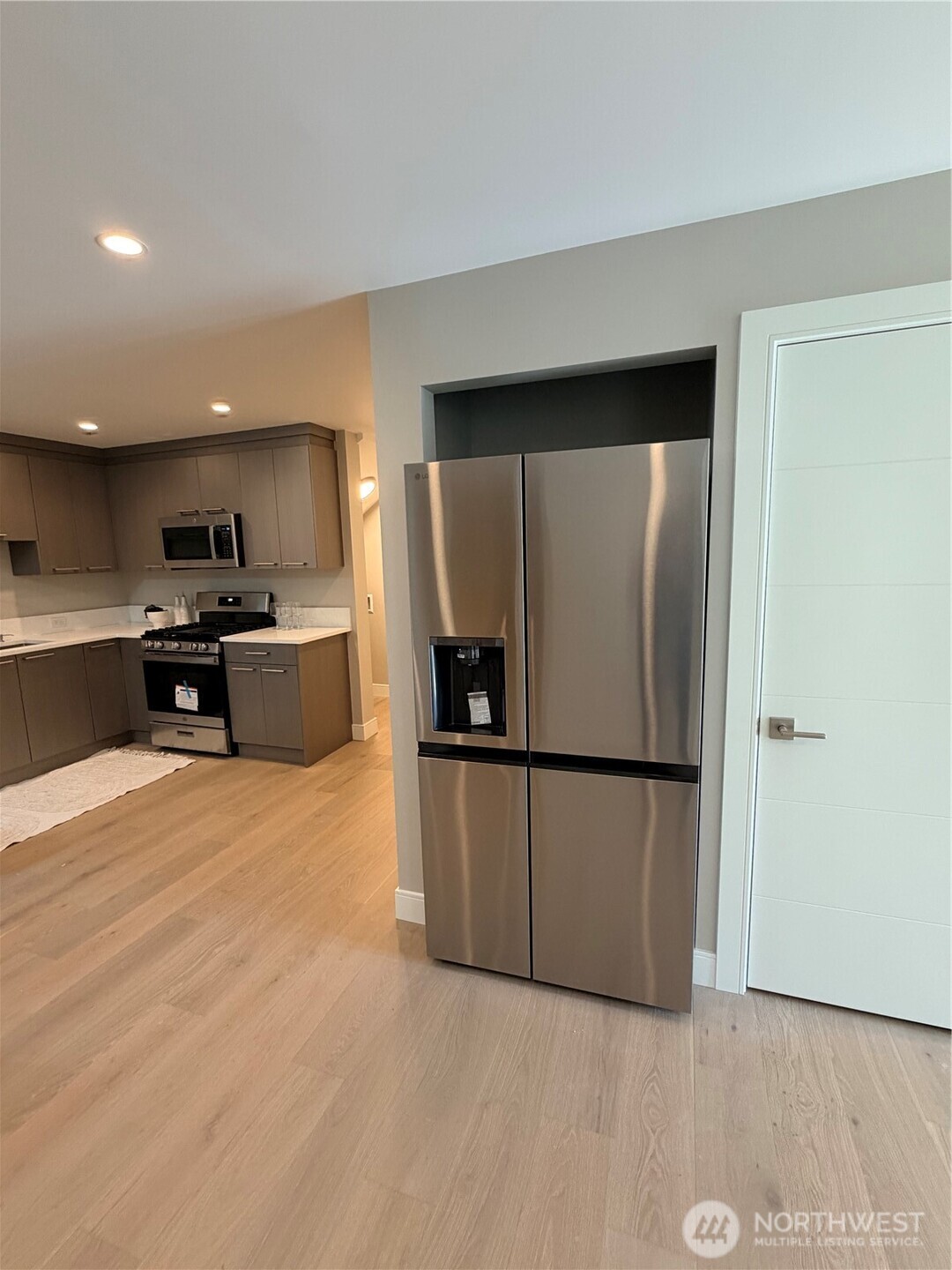 4305 Northeast 26th Court Renton, WA 98059 - Photo 36 of 40 a kitchen with stainless steel appliances a refrigerator and a microwave