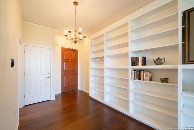 a view of a livingroom with a furniture wooden floor and a window