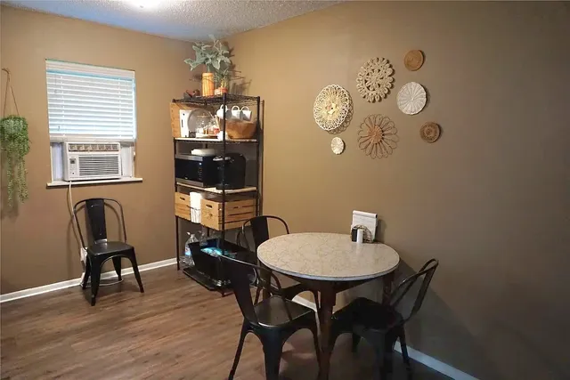 a view of a room with furniture window and wooden floor