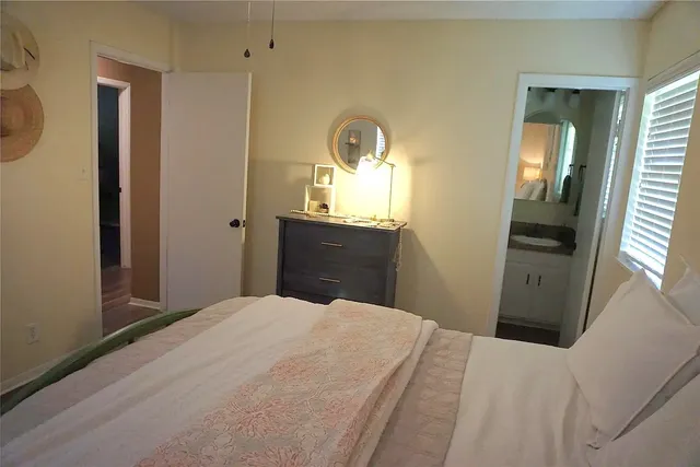 a bedroom with a bed and a dresser