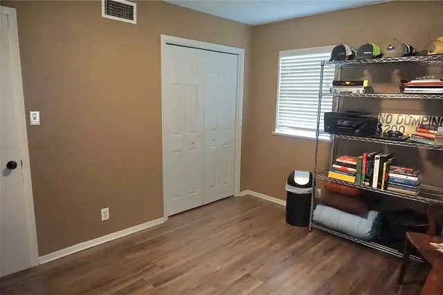 a view of workspace with wooden floor