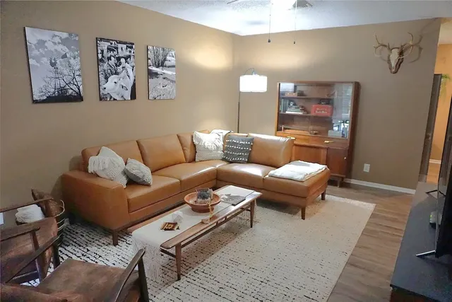 a living room with furniture and a rug