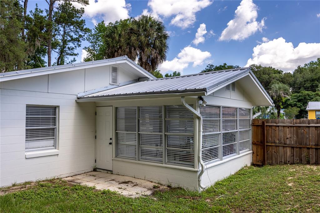 113 Browns Road San Mateo, FL 32187 - Photo 29 of 36 a view of a house with a yard