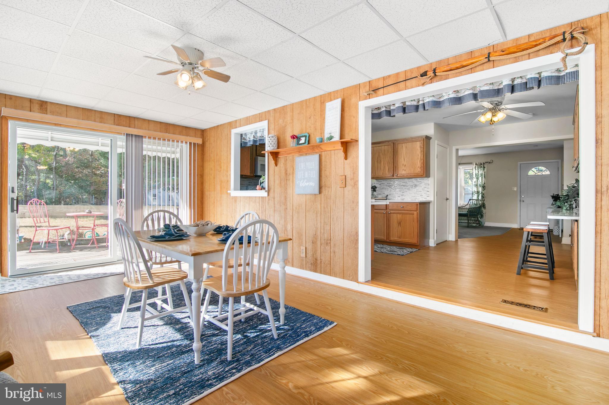 21633 Wetipquin Road Tyaskin, MD 21865 - Photo 14 of 88 a view of a dining room with furniture wooden floor and a chandelier