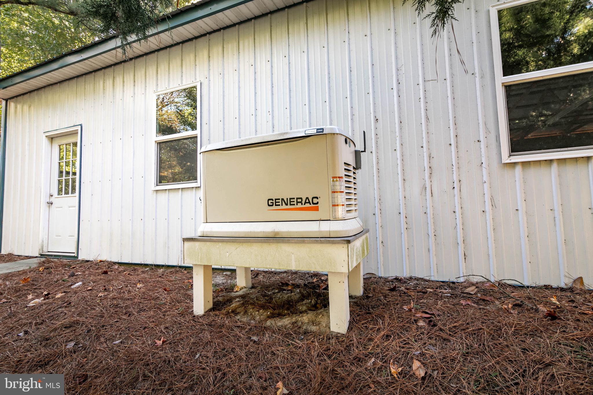 21633 Wetipquin Road Tyaskin, MD 21865 - Photo 51 of 88 a view of a wooden bench in front of a house