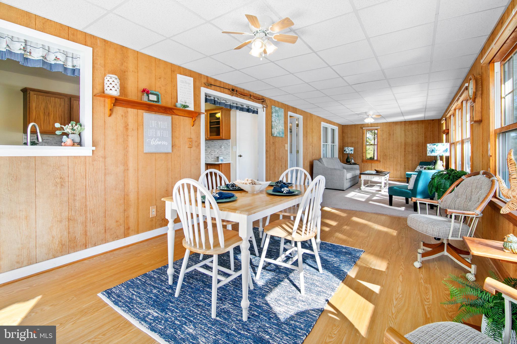 21633 Wetipquin Road Tyaskin, MD 21865 - Photo 8 of 88 a view of a dining room with furniture window and wooden floor