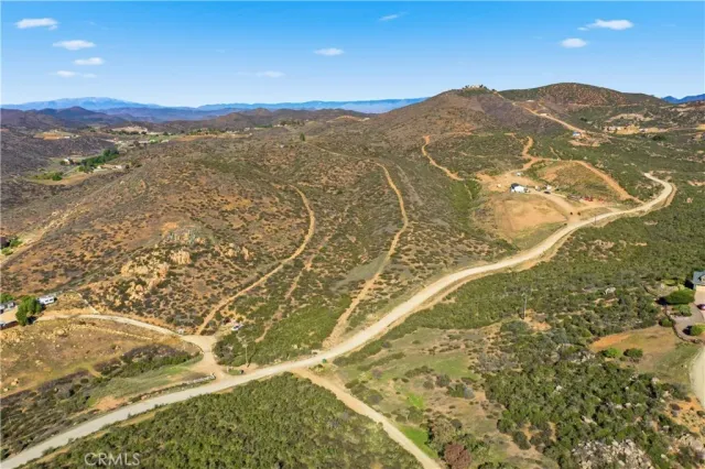 a view of a yard with a mountain