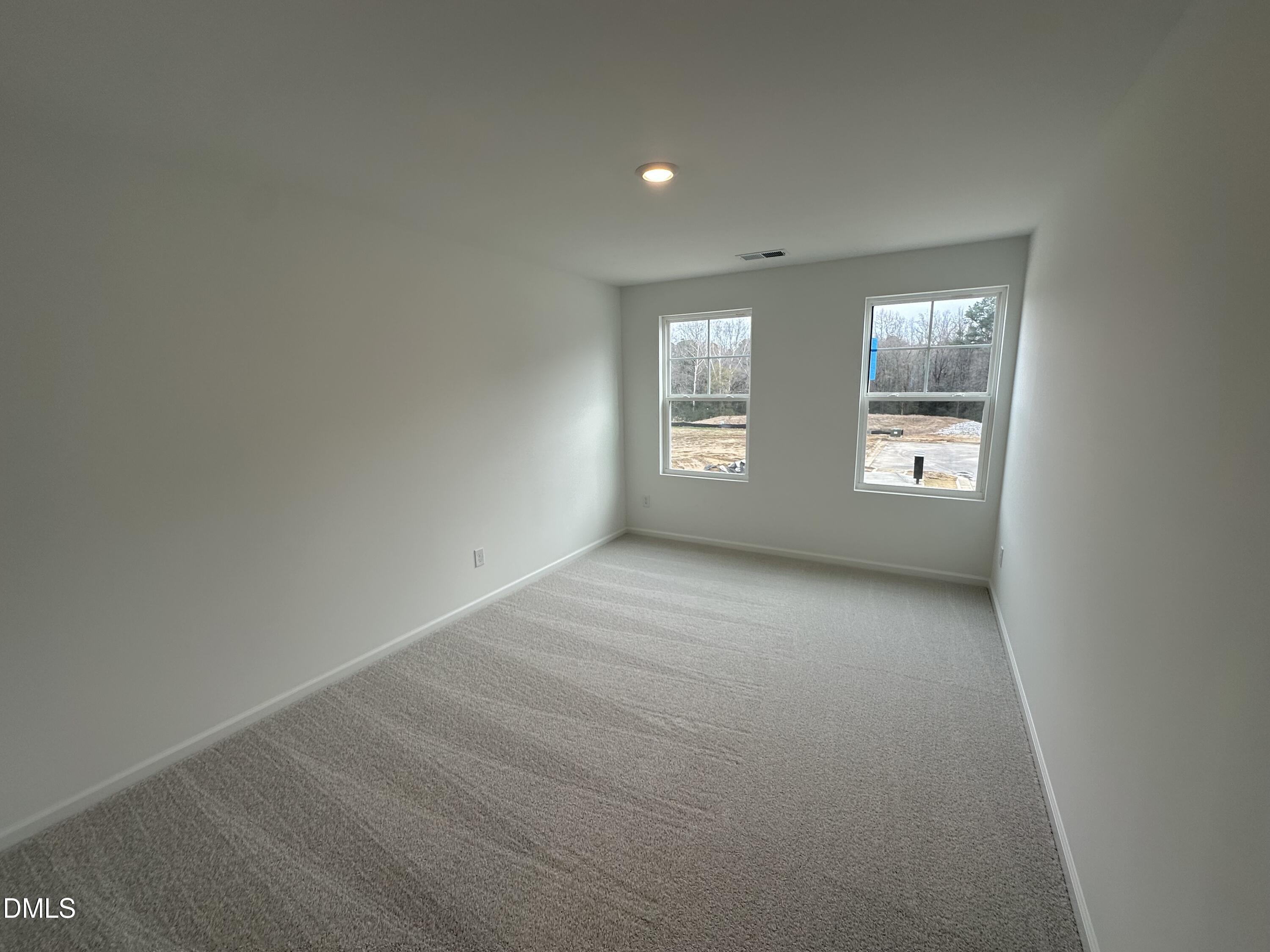 2917 Hickory Fld Drive Raleigh, NC 27616 - Photo 17 of 28 an empty room with windows