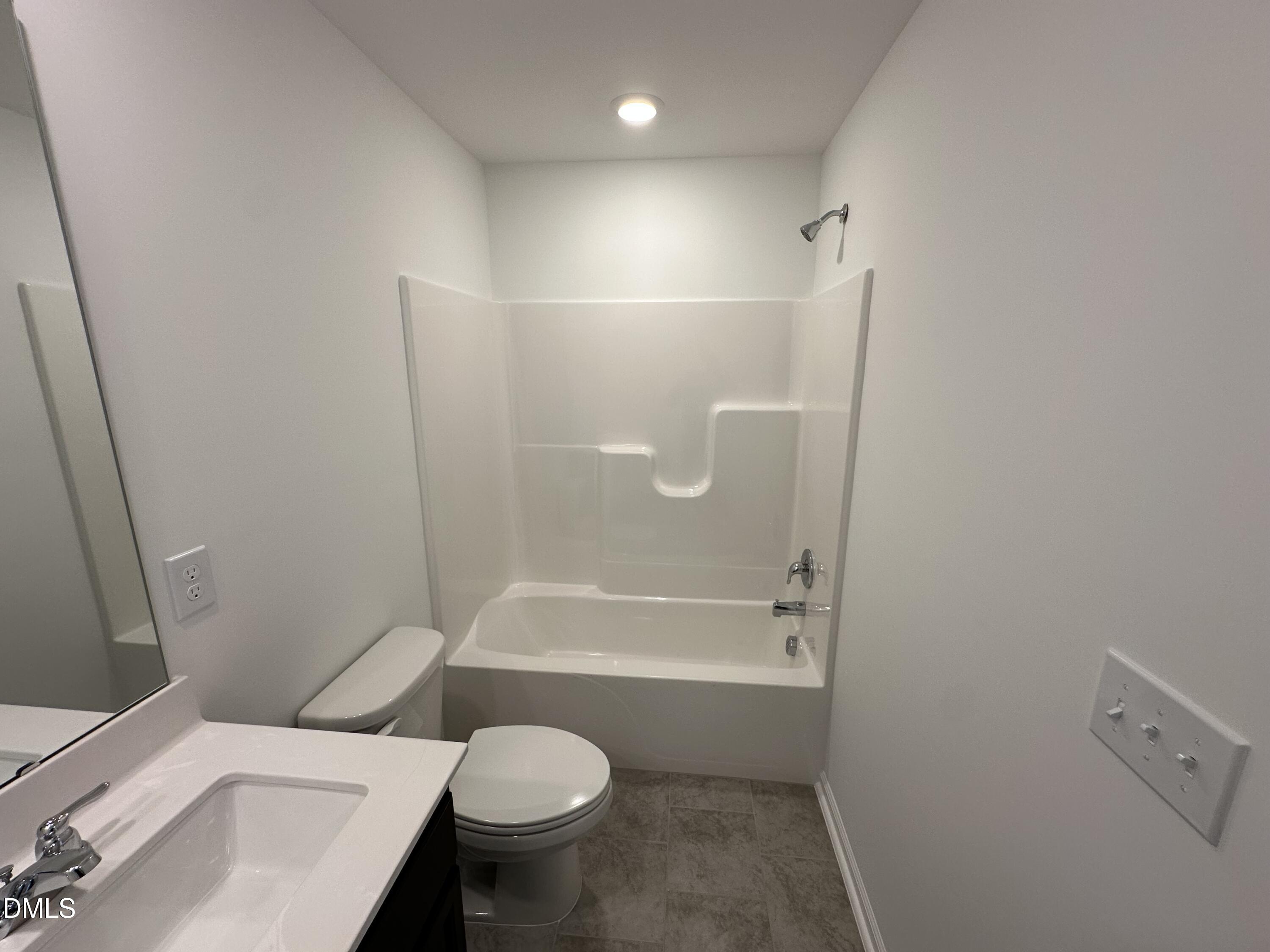 2917 Hickory Fld Drive Raleigh, NC 27616 - Photo 20 of 28 a white toilet sitting next to a bath tub