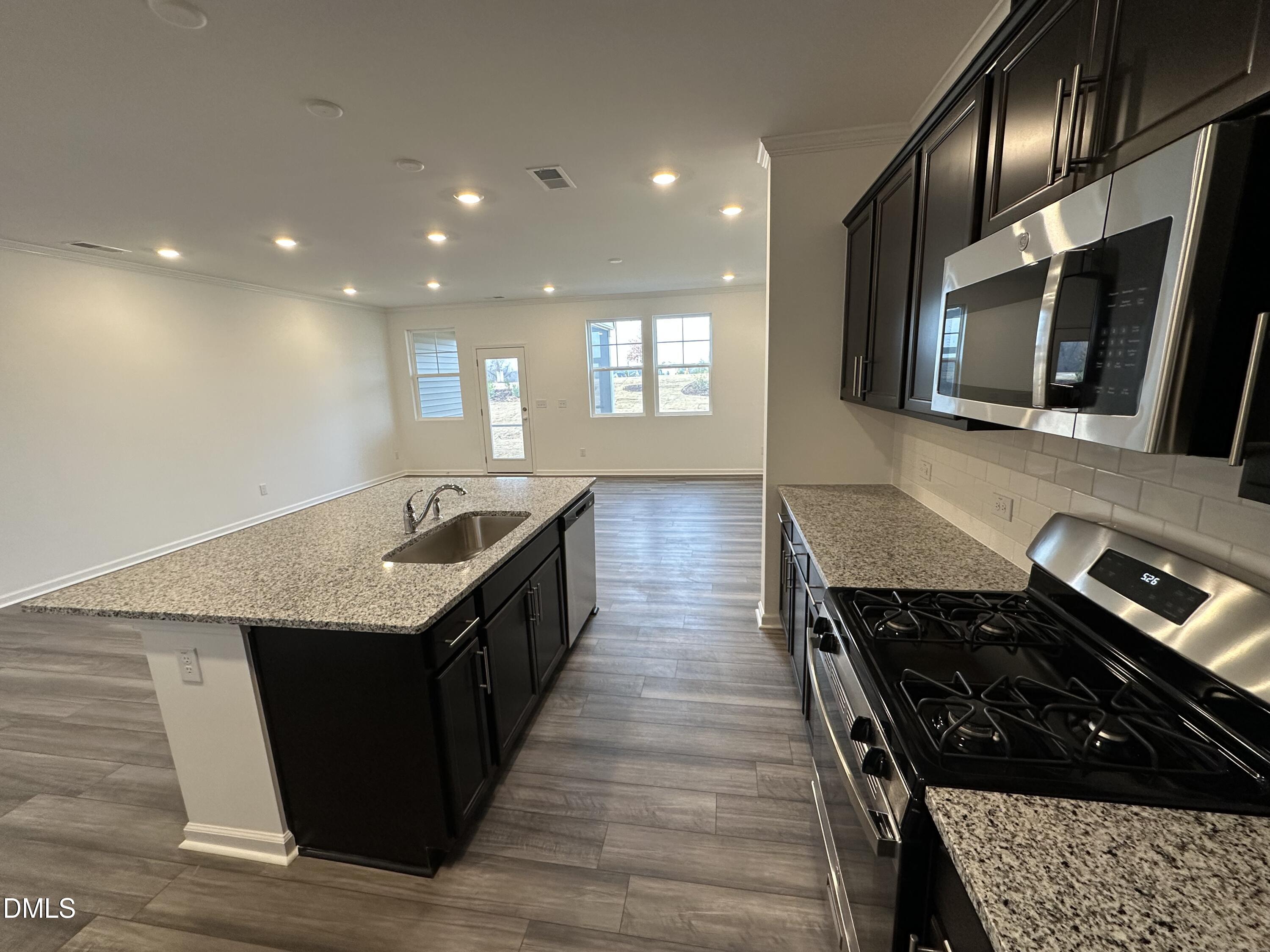 2917 Hickory Fld Drive Raleigh, NC 27616 - Photo 2 of 28 a kitchen with a stove and a sink