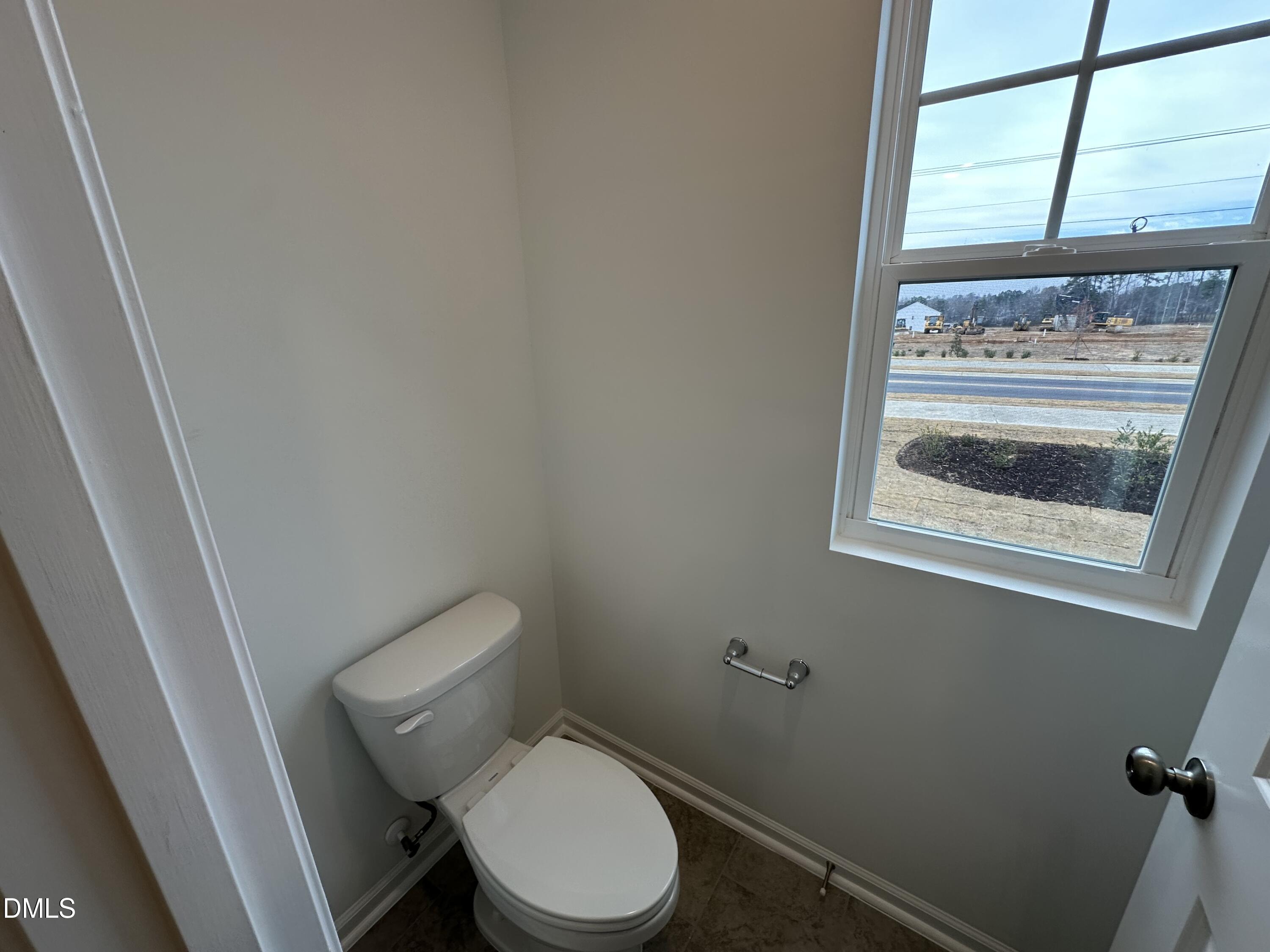 2917 Hickory Fld Drive Raleigh, NC 27616 - Photo 27 of 28 a white toilet sitting next to a window
