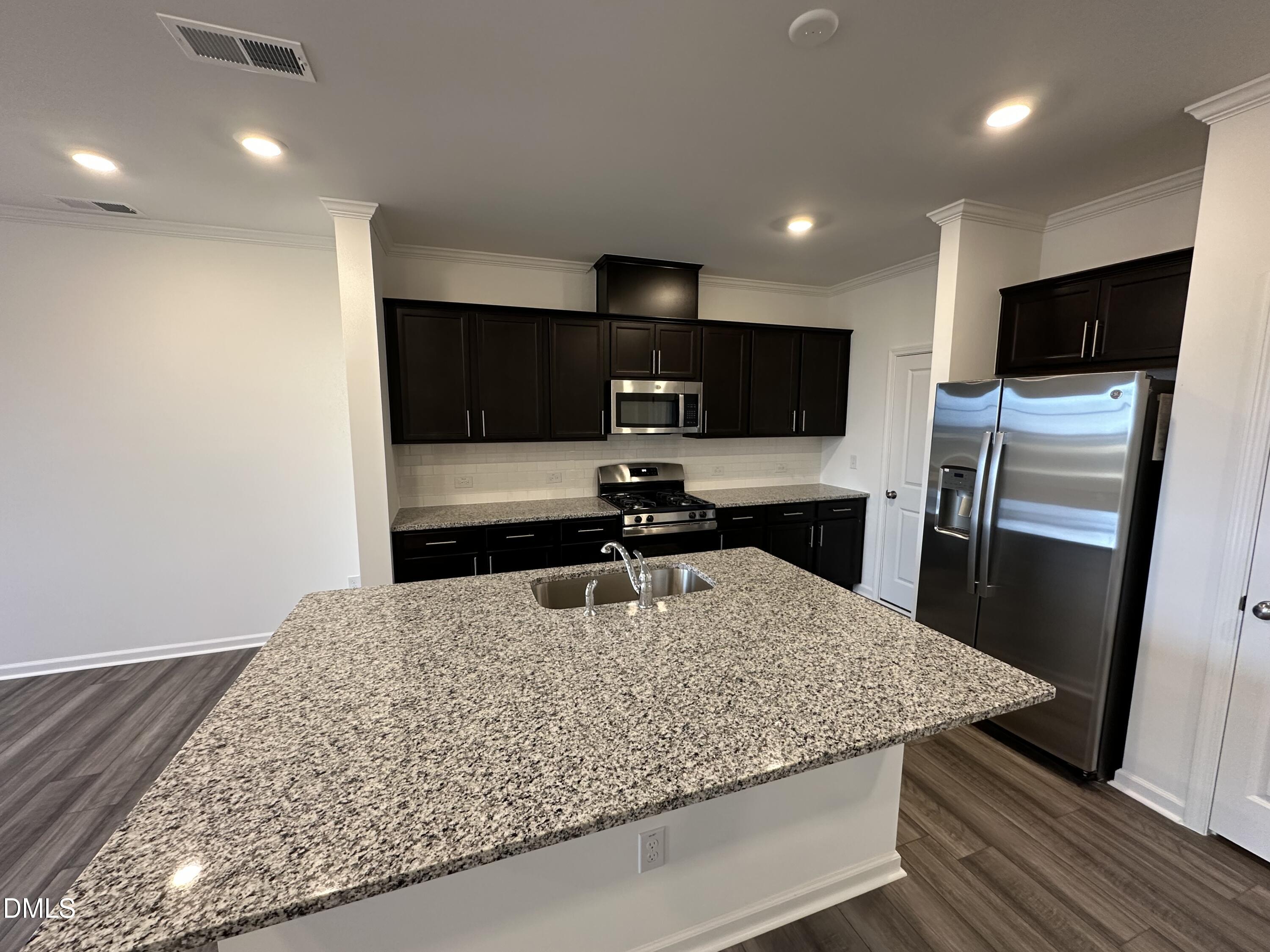 2917 Hickory Fld Drive Raleigh, NC 27616 - Photo 3 of 28 a kitchen with a sink microwave and refrigerator