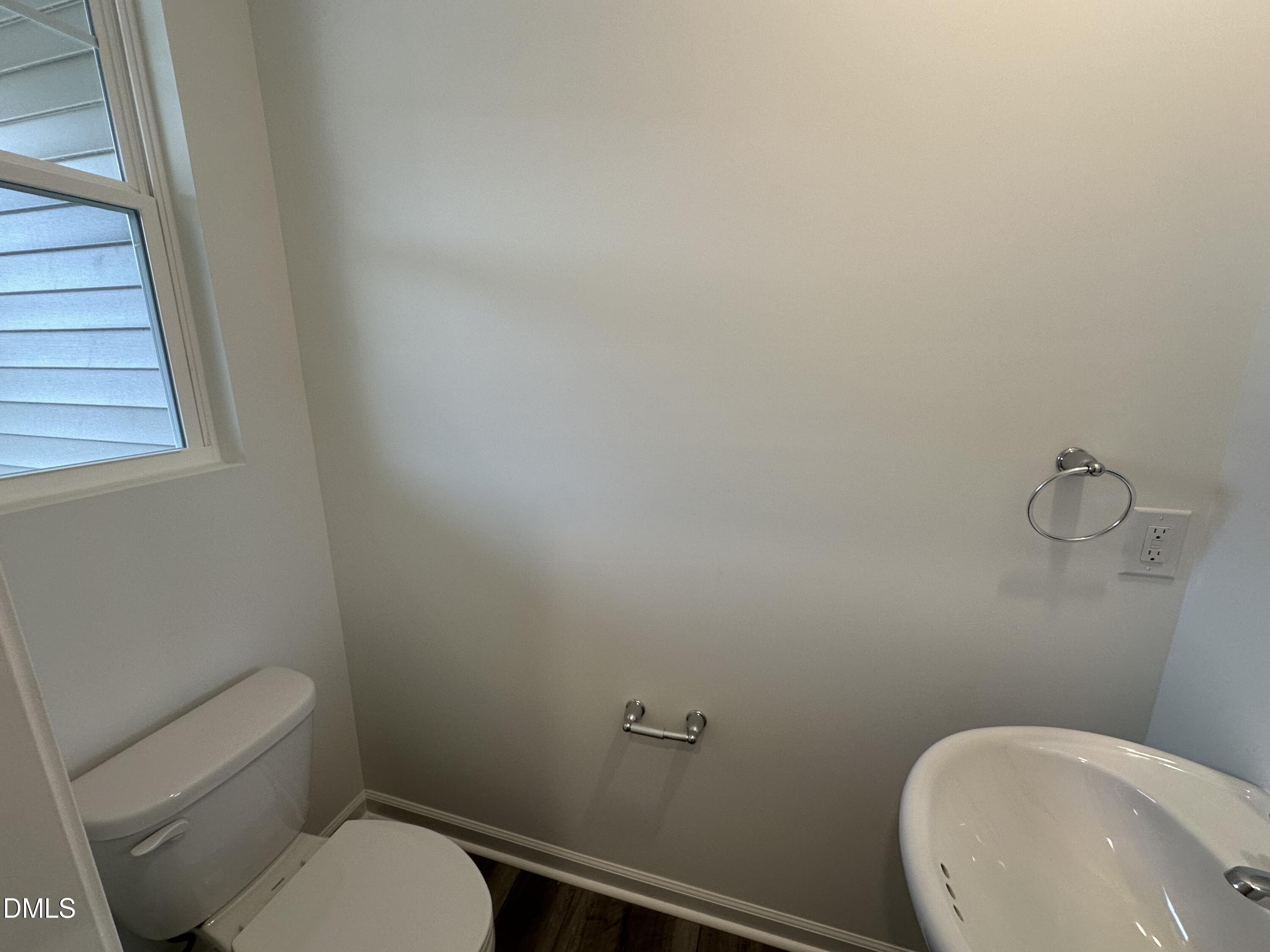 2917 Hickory Fld Drive Raleigh, NC 27616 - Photo 10 of 28 a white toilet sitting next to a white sink and vanity