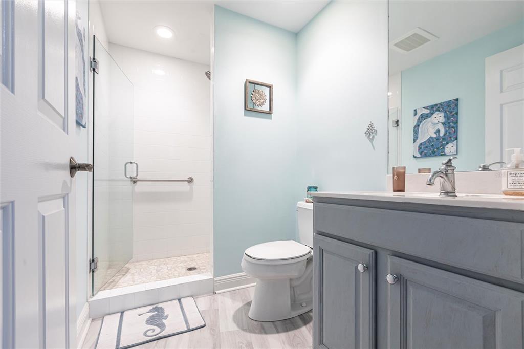 3329 Sunset Key Circle, Unit 107 Punta Gorda, FL 33955 - Photo 27 of 76 a bathroom with a sink a toilet and shower