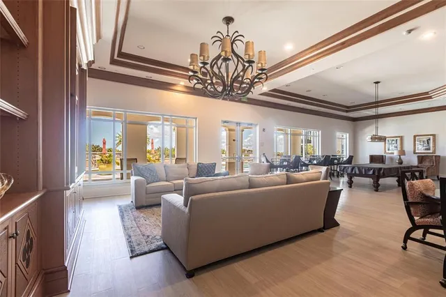 a media room with lots of chairs and a projector screen