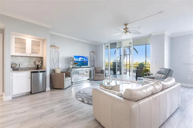 a kitchen with stainless steel appliances kitchen island granite countertop a refrigerator and microwave