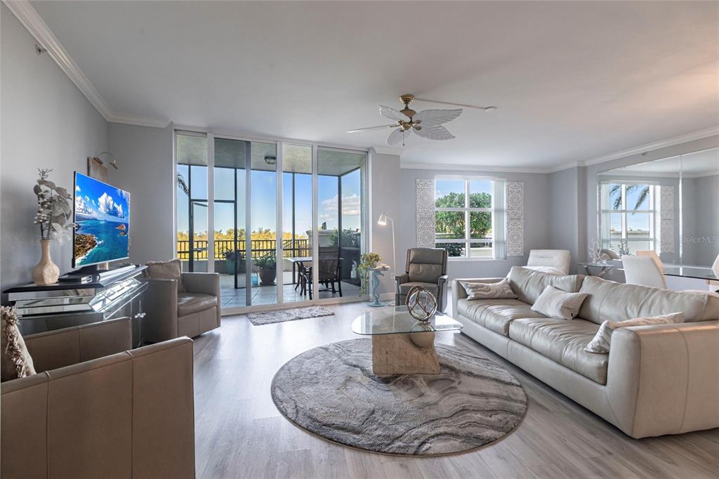 3329 Sunset Key Circle, Unit 107 Punta Gorda, FL 33955 - Photo 6 of 76 a living room with furniture and a flat screen tv