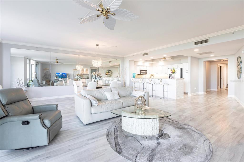 3329 Sunset Key Circle, Unit 107 Punta Gorda, FL 33955 - Photo 7 of 76 a living room with furniture and a large mirror with wooden floor