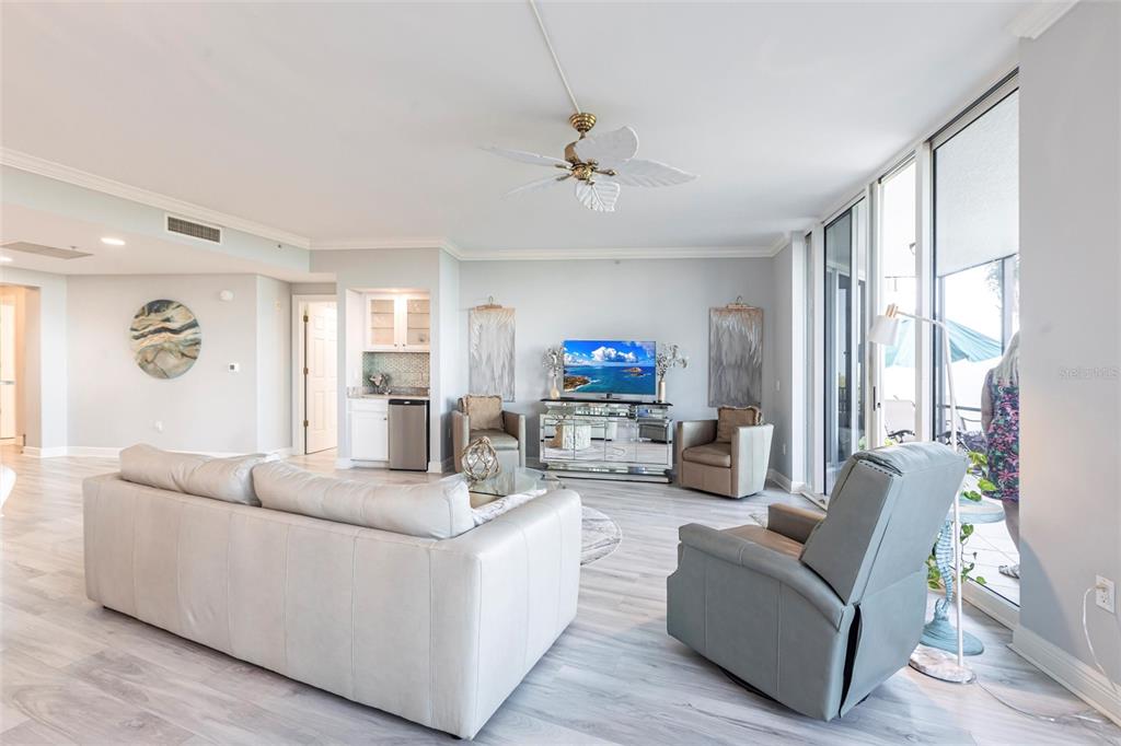 3329 Sunset Key Circle, Unit 107 Punta Gorda, FL 33955 - Photo 9 of 76 a living room with fireplace furniture and a large window