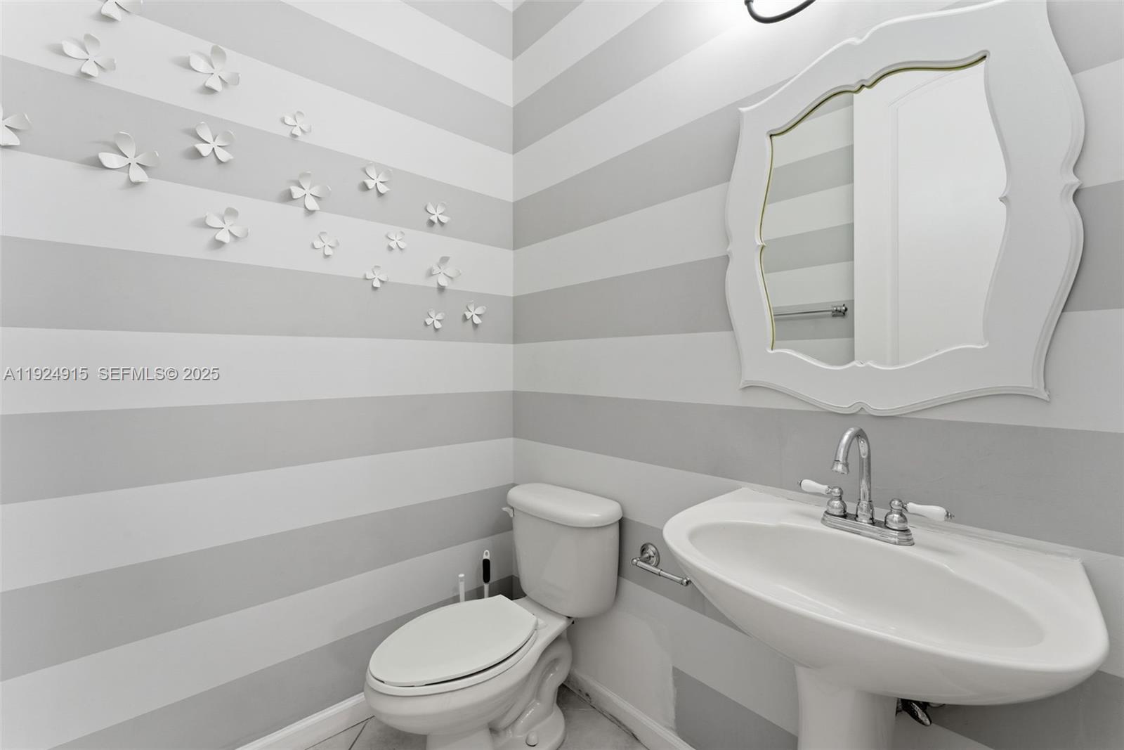 2651 Southwest 119th Terrace, Unit 1109 Miramar, FL 33025 - Photo 13 of 25 a bathroom with a sink a toilet and shower