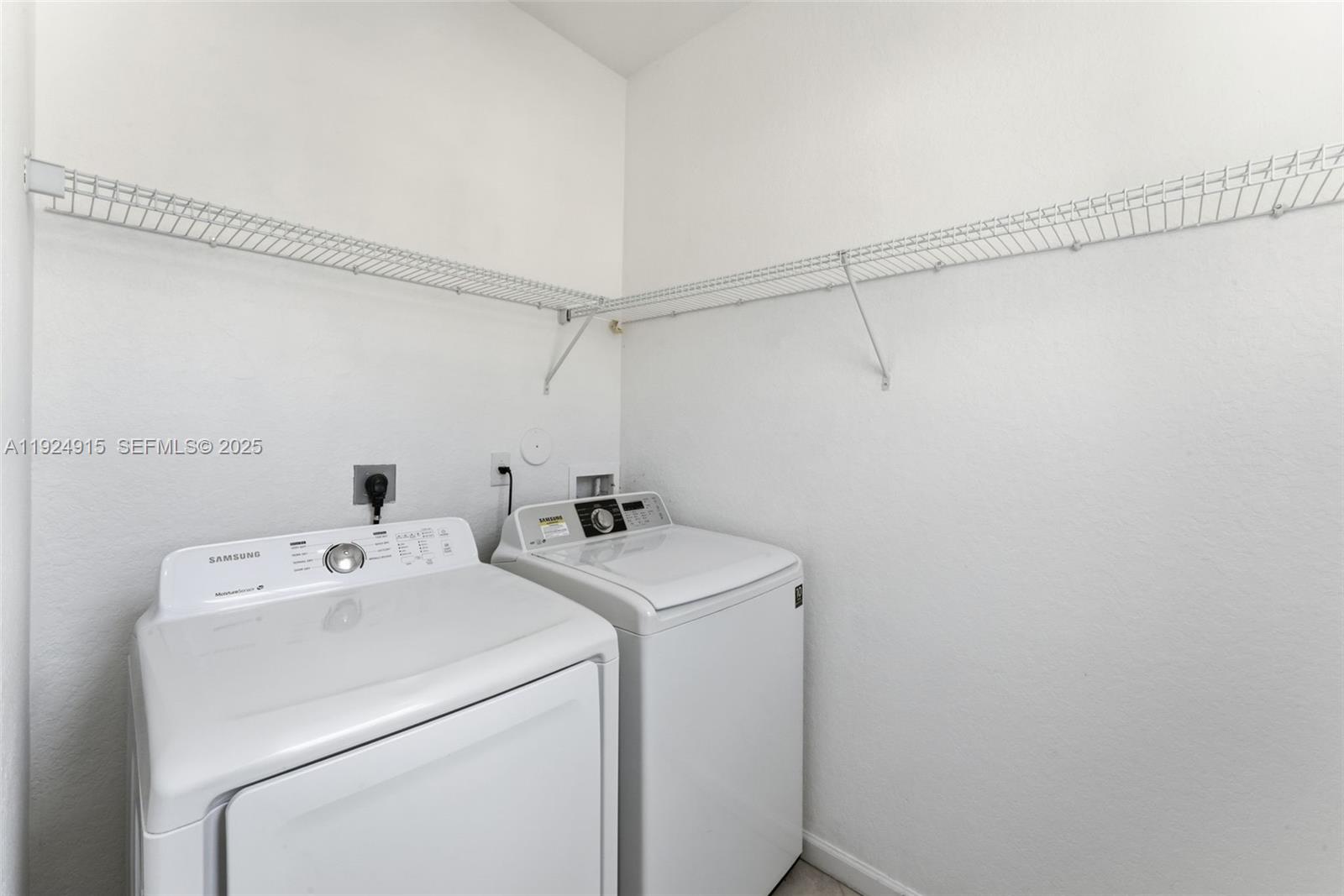 2651 Southwest 119th Terrace, Unit 1109 Miramar, FL 33025 - Photo 14 of 25 a utility room with dryer and washer