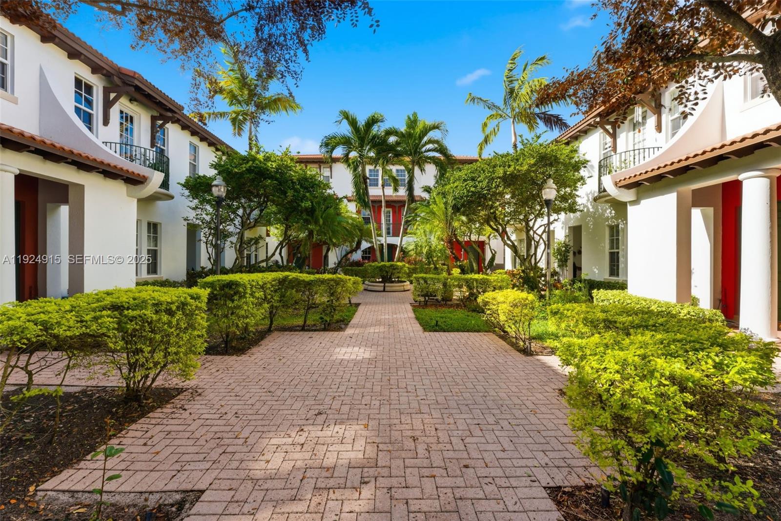 2651 Southwest 119th Terrace, Unit 1109 Miramar, FL 33025 - Photo 2 of 25 a view of a pathway with a house