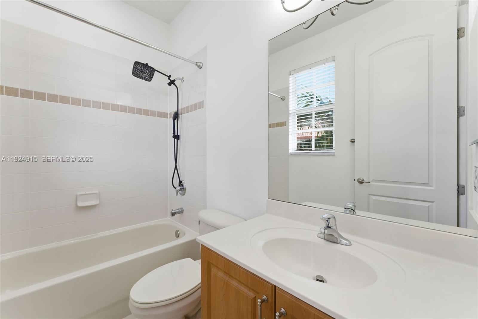 2651 Southwest 119th Terrace, Unit 1109 Miramar, FL 33025 - Photo 21 of 25 a bathroom with a sink toilet tub and shower