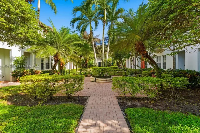 a view of a pathway with a yard