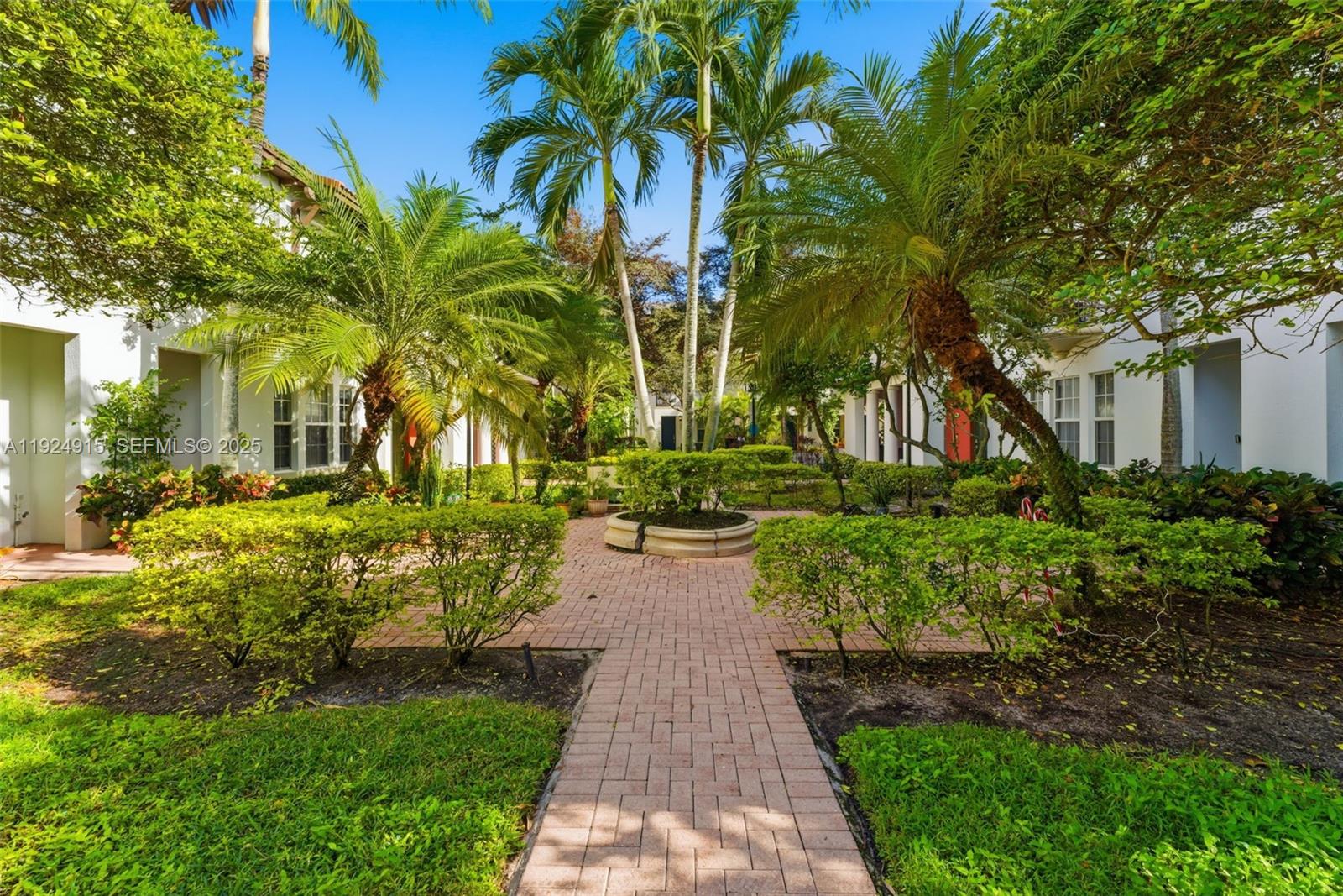 2651 Southwest 119th Terrace, Unit 1109 Miramar, FL 33025 - Photo 3 of 25 a view of a pathway with a yard